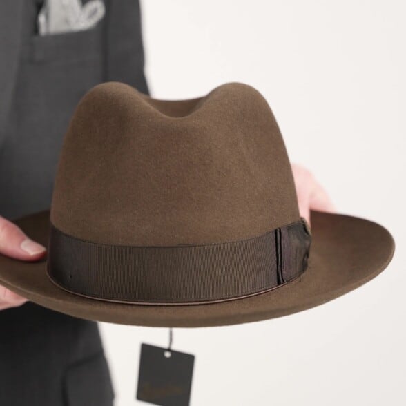 Preston holding the Brown Beaver Fur Borsalino felt hat